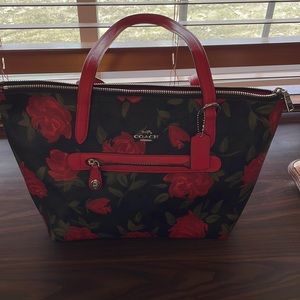 Excellent used condition rose covered COACH bag.